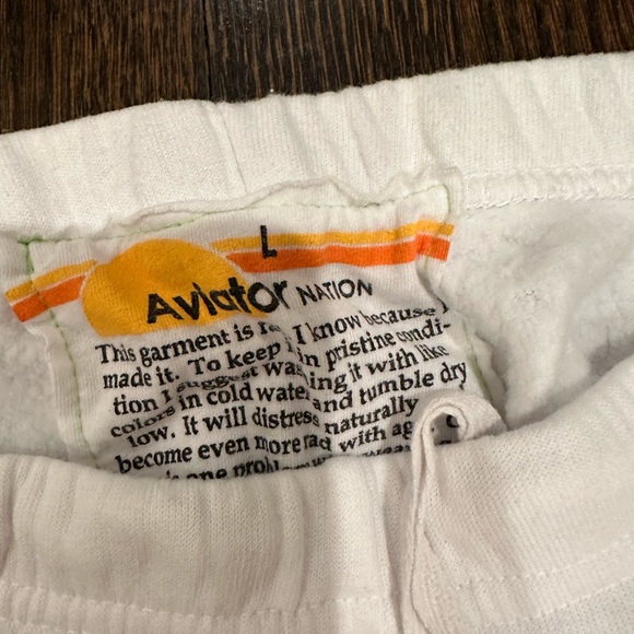 Aviator Nation women’s white sweatpants with rainbow stripes wrapped around leg - Picture 2 of 2